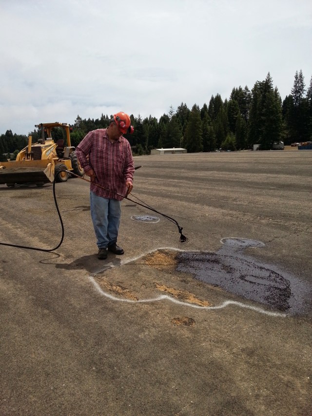 Shallow spots required only oil and sand while deeper holes needed to be filled with gravel first. Tuesday, July 15, 2014